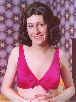 Joy wears her first and only bikini in her bedroom