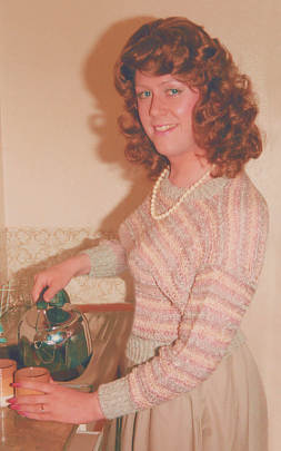 Joy pours from kettle to make tea