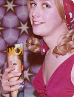 Teenage Joy holds a rolled up 'Look Now' magazine