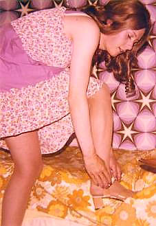 Joy puts her sandals on